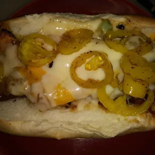 The Piccadilly .black forest sausage..grilled onion/ green pepper and grilled banana peppers topped with tons of swiss and cheddar cheese