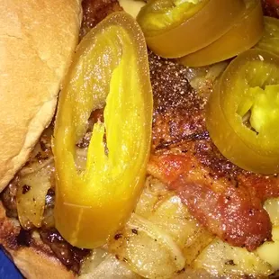 Build your own burger with American cheese , grilled onions,pepper bacon and jalapeños