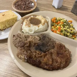a plate of meat and vegetables