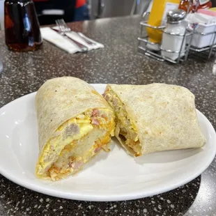 a breakfast burrito on a plate