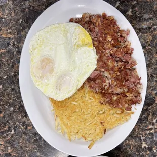 Corned Beef Hash Hash browns over medium eggs.