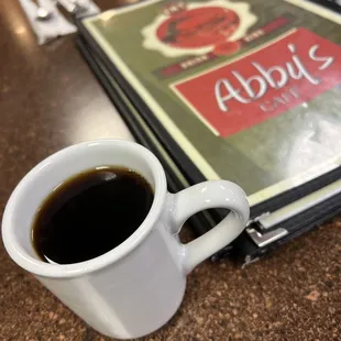 a cup of coffee on a table