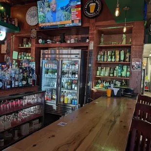 a bar with a television on the wall
