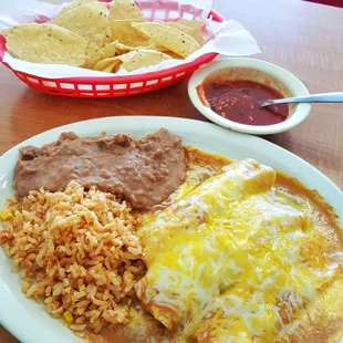 a plate of enchiladas and rice