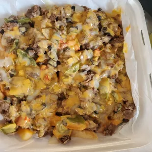 Steak Fries with mushrooms onions green peppers and cheese throughout!