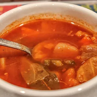 a bowl of soup with a spoon in it