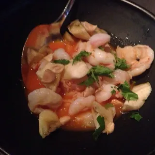 Shrimp ceviche in "agua diablo" marcona almonds, banana and cilantro