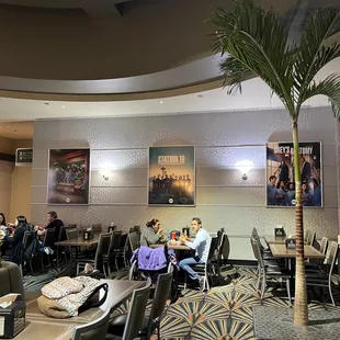 people sitting at tables in a restaurant