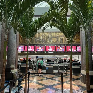 an airport with palm trees