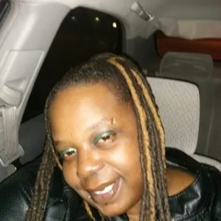 a woman with dreadlocks in a car