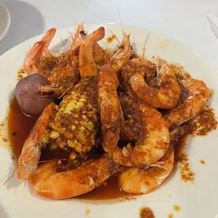 Seafood boiled with house cajun spicy hot sauce