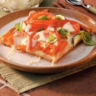 a slice of pizza on a plate