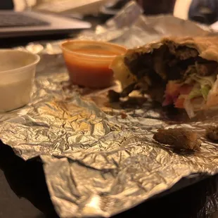 Gyro wrap and homemade hot sauce.
