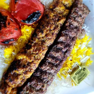 Beef and Chicken Koobideh Combo on a bed of rice and grilled tomatoes