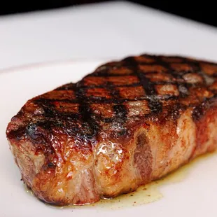 a steak on a white plate