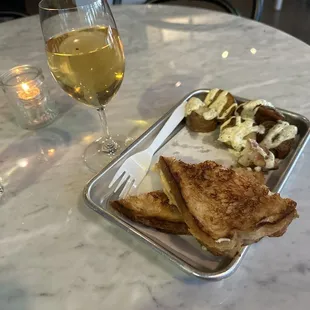 This is a plain Jane with Gouda on sour dough bread. These are the duck fat  roasted potatoes. Company buy a glass of wine from Holly's.