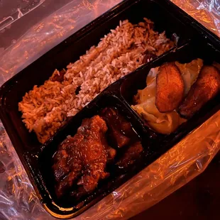 Oxtails, cabbage, rice and peas, plantains