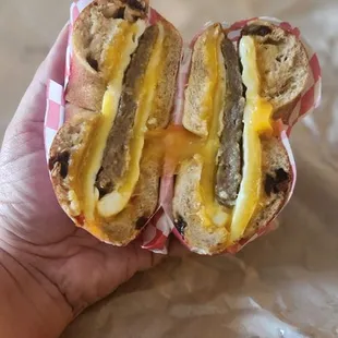 Breakfast sandwich: sausage, eggs and cheese on a cinnamon roll bagel. Perfection
