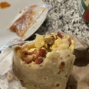 The bacon potato egg and cheese breakfast burrito. Pre packaged red salsa but has a good kick to it!