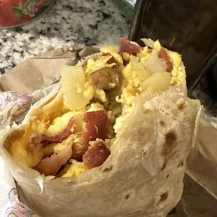 Bacon egg and cheese breakfast taco with added sausage