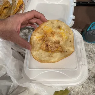 Fried chicken taco, maybe 1Tablespoon of meat if that.