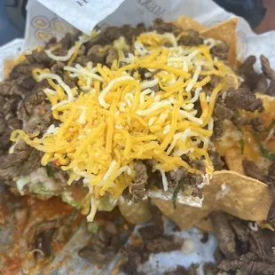 Steak nachos ..fresh crunchy chips with lots of toppings..generous portions for sharing guacamole is authentic...and lots of YUMMNESS!