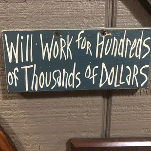 a sign saying will work for hundreds of thousands of dollars