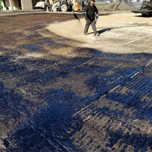 a man standing on a dirt road