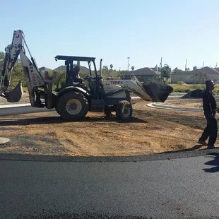 a man working on a driveway