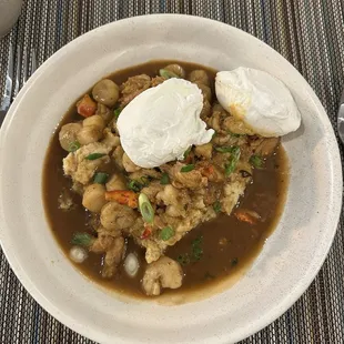 Seafood and grits with poached eggs.