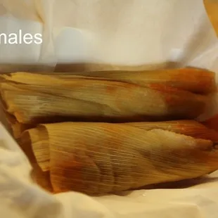 tamales in a paper bag