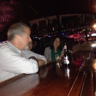 people sitting at a bar