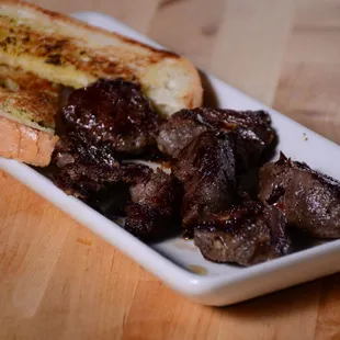Filet Mignon Tips served with garlic bread!
