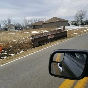After dangerously blocking a neighborhood entrance with this unmarked thing, this is where they moved it,  hope they get fined!