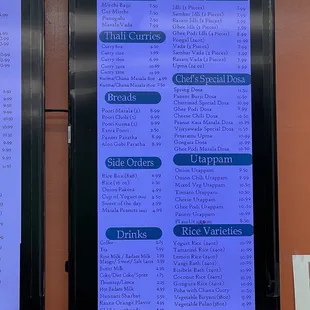 a menu on a wall in a restaurant
