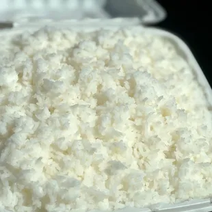a close up of a container of rice