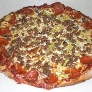 a pizza with meat and vegetables