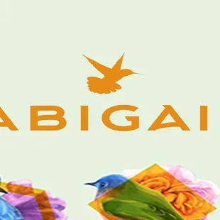 two colorful birds with a gift in their beaks