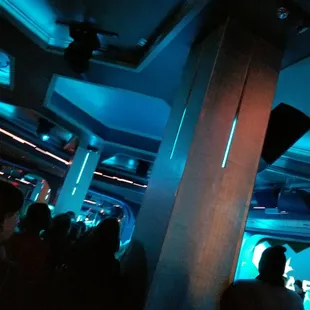 a group of people in a dark room