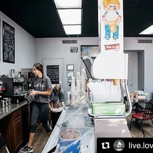 a woman standing at the counter