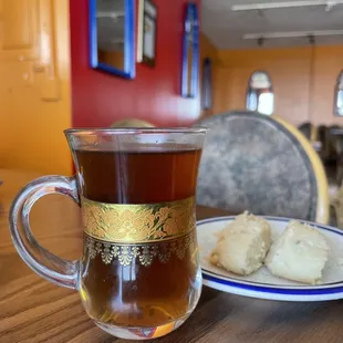 a cup of tea and a plate of biscuits