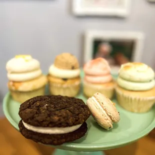 cookies and cupcakes on a cake stand