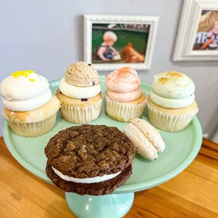 cupcakes and cookies on a cake stand