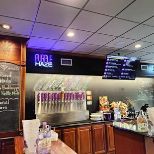 a bar with a chalkboard menu