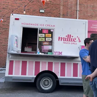 a pink and white ice cream truck