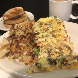 Custom omelette, home fries, and rye toast. Don't forget the coffee &amp; glass of ice water!
