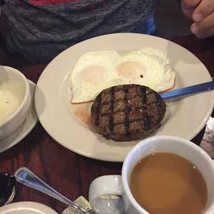 Over easy eggs with an angus beef patty