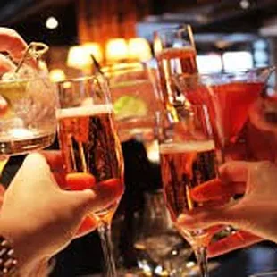 people clinking glasses of champagne