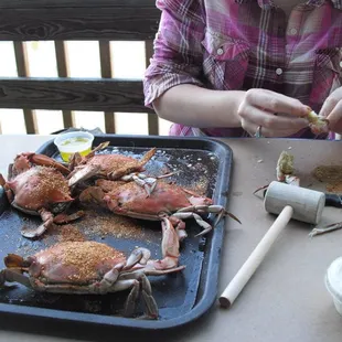 a woman preparing crab