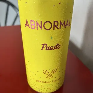 a yellow can with sprinkles on it